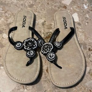 Brand new women’s black and white flip-flops